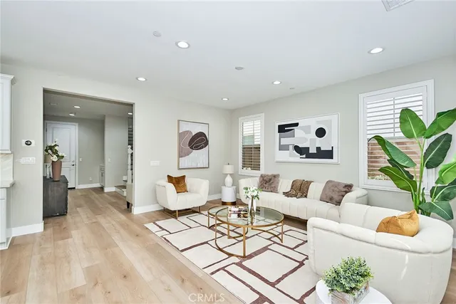 a living room with furniture and a rug