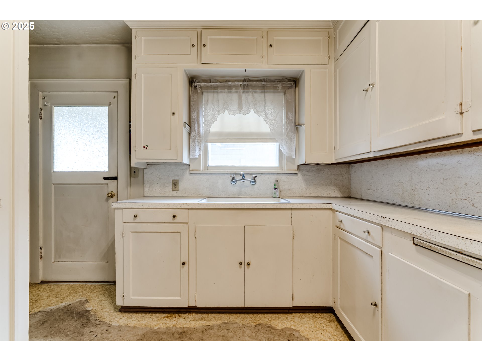835 Maple Street Junction City, OR 97448 - Photo 11 of 29 a kitchen with cabinets appliances and a window