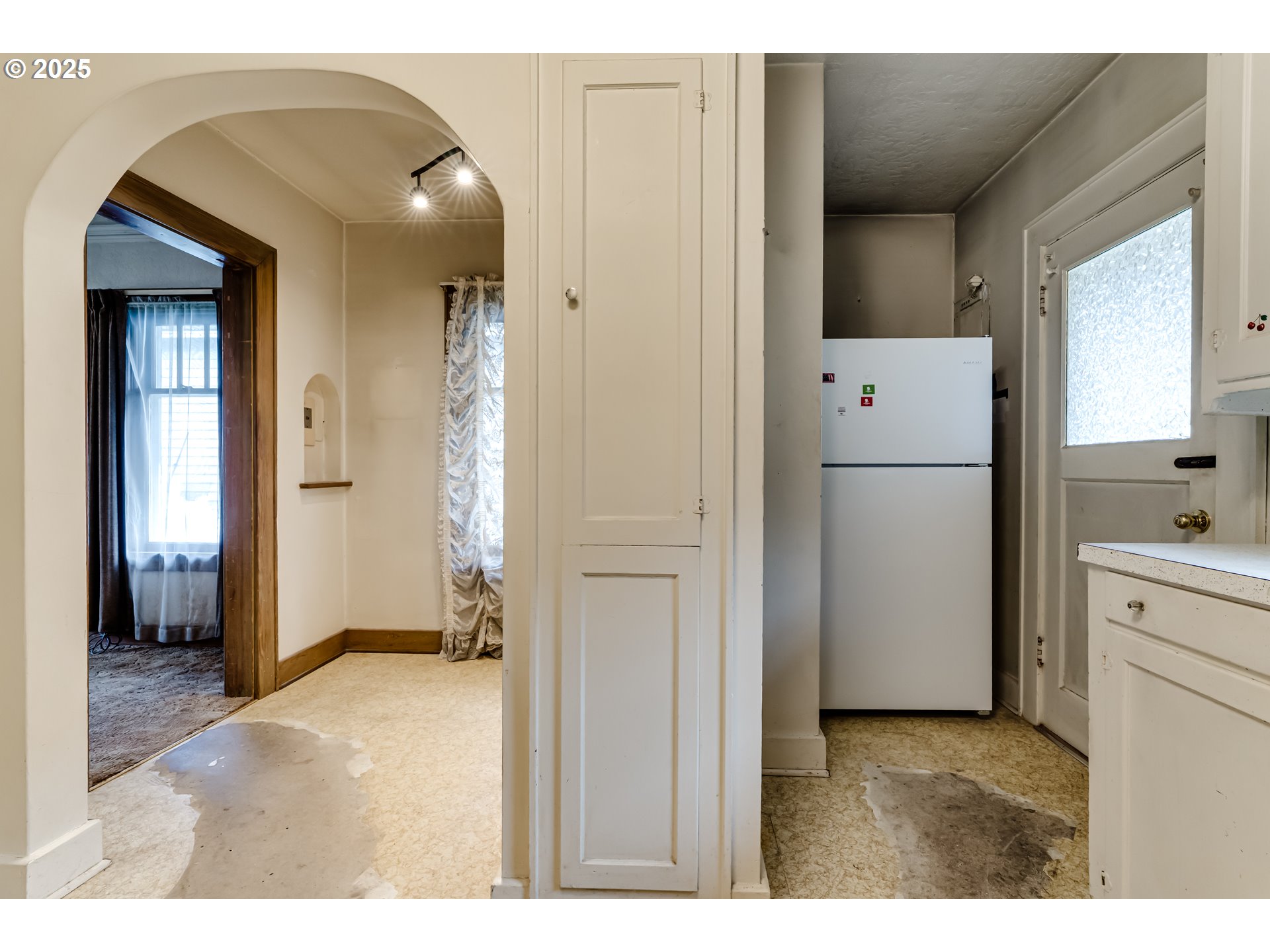 835 Maple Street Junction City, OR 97448 - Photo 12 of 29 a kitchen with a refrigerator and a sink