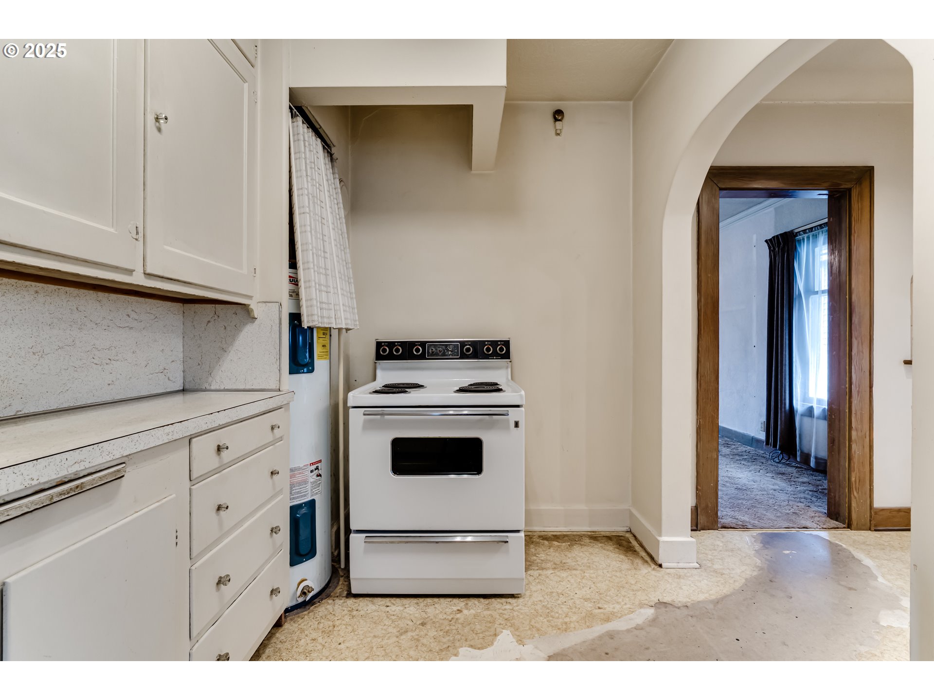 835 Maple Street Junction City, OR 97448 - Photo 13 of 29 a kitchen with cabinets and white appliances
