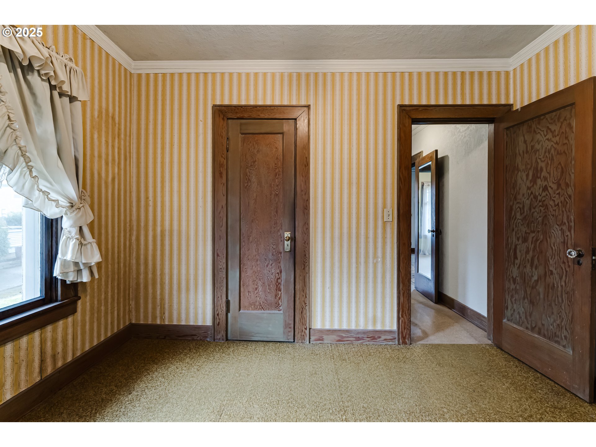 835 Maple Street Junction City, OR 97448 - Photo 21 of 29 a view of an empty room with wooden floor