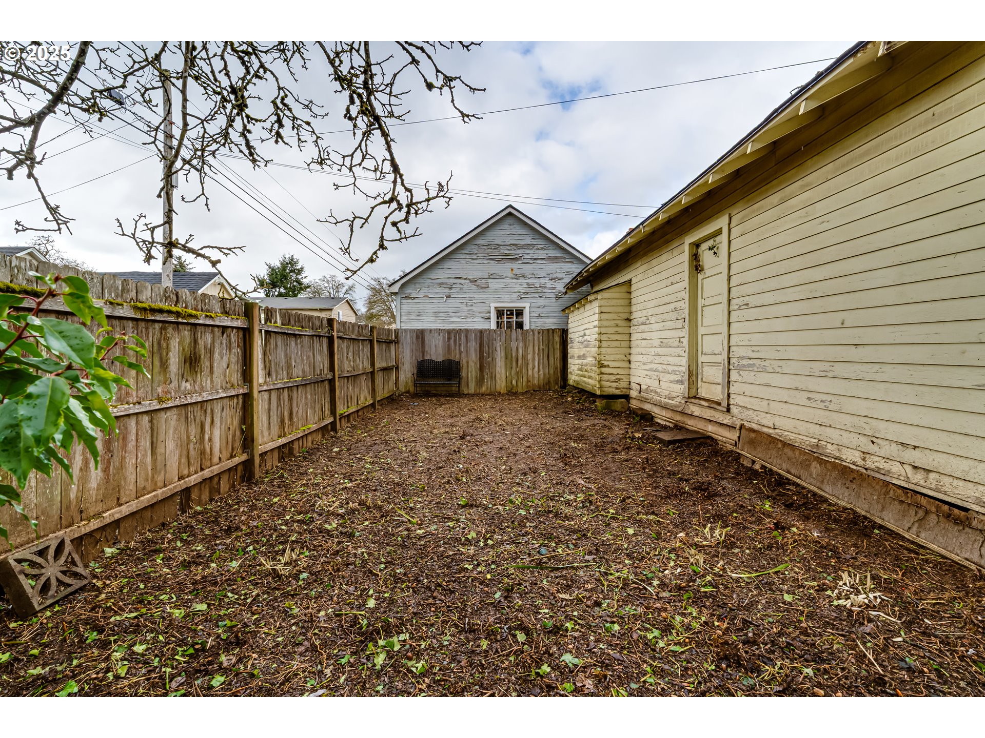 835 Maple Street Junction City, OR 97448 - Photo 27 of 29 a view of a house with a wooden fence
