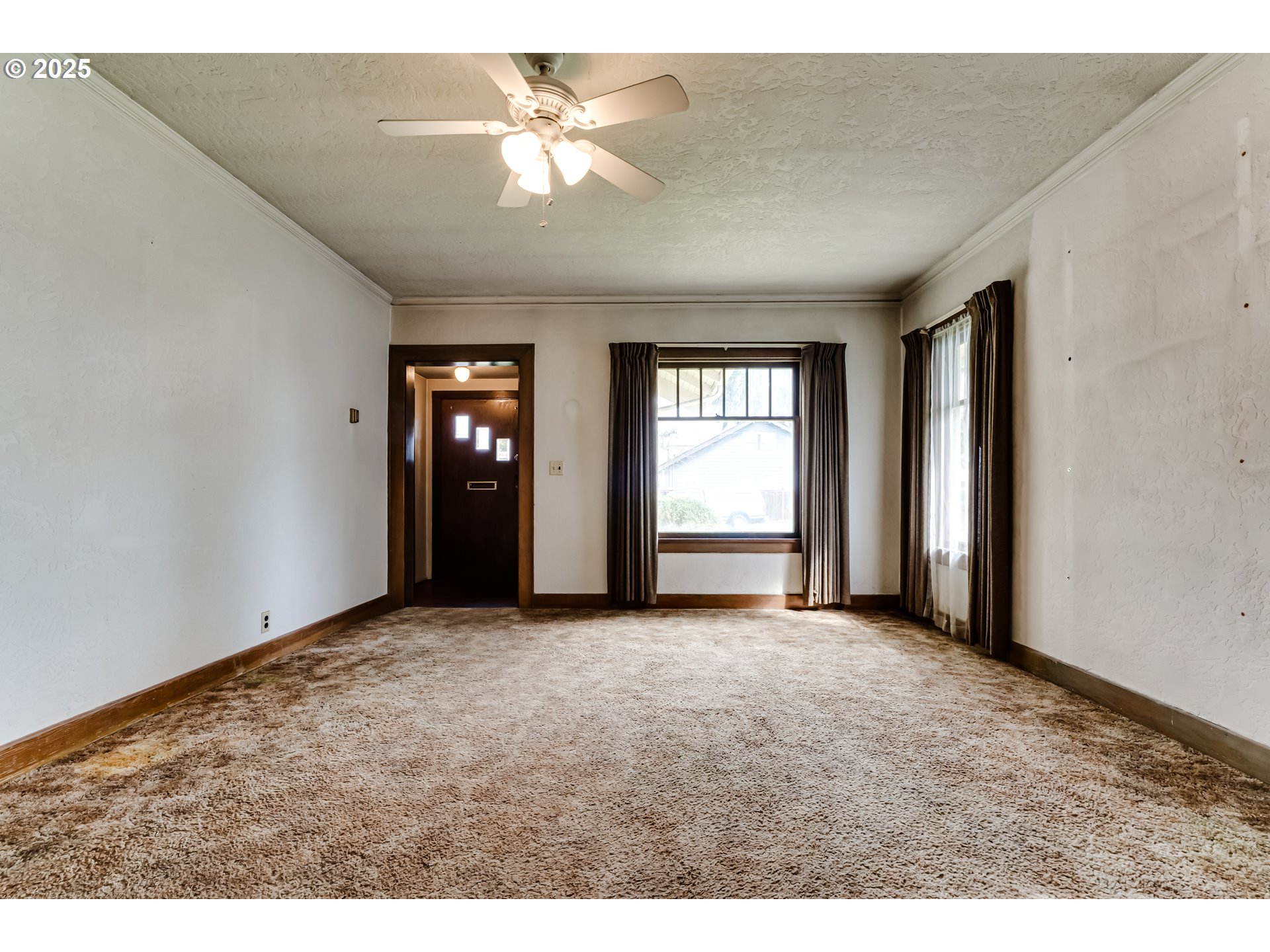 835 Maple Street Junction City, OR 97448 - Photo 4 of 29 a view of an empty room with a window