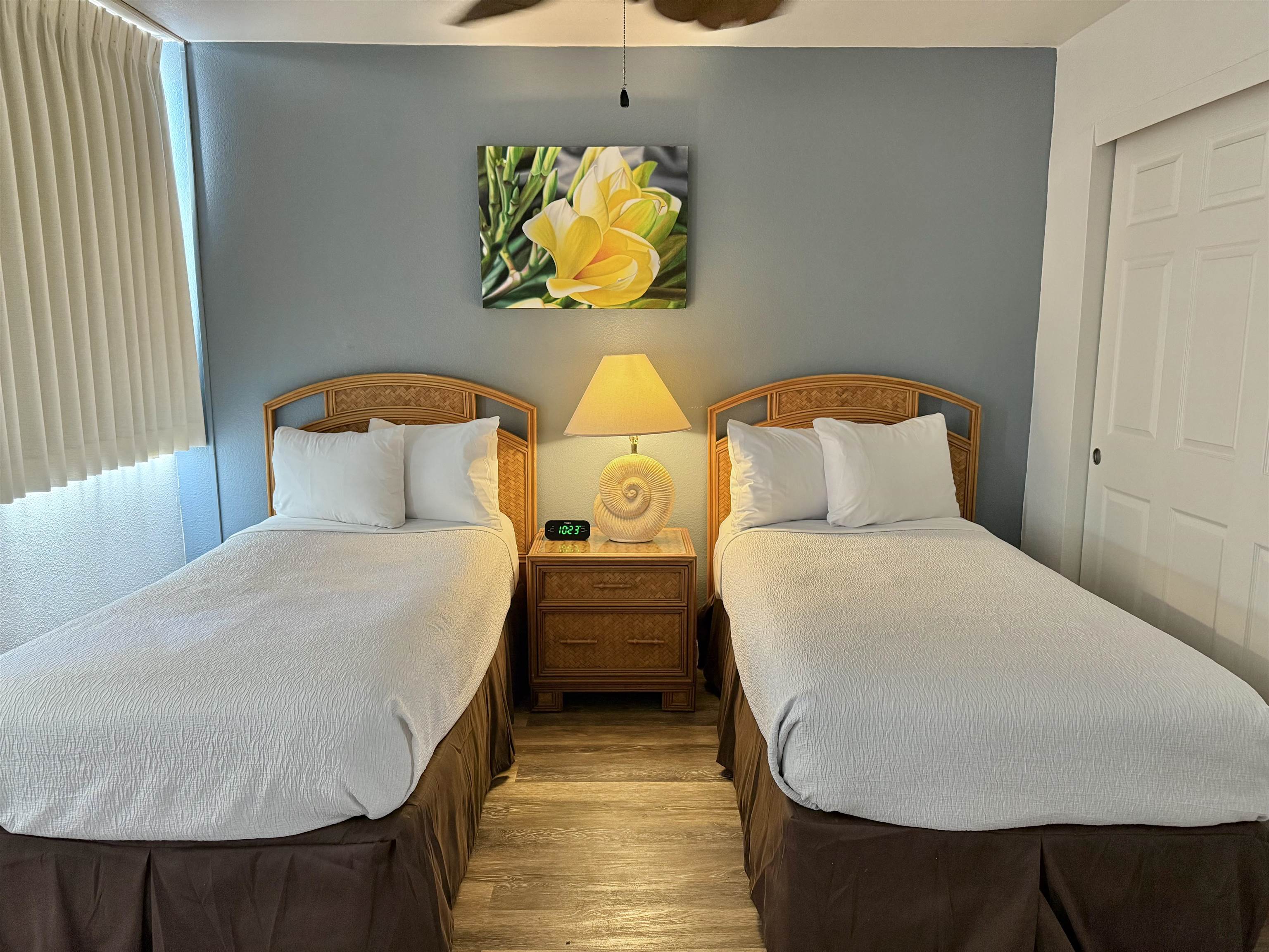 4365 Lower Honoapiilani Road, Unit 801 Lahaina, HI 96761 - Photo 11 of 24 a bedroom with a bed and painting on the wall