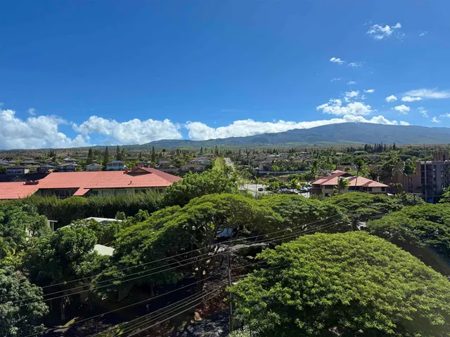 a view of a lake with a table and chairs