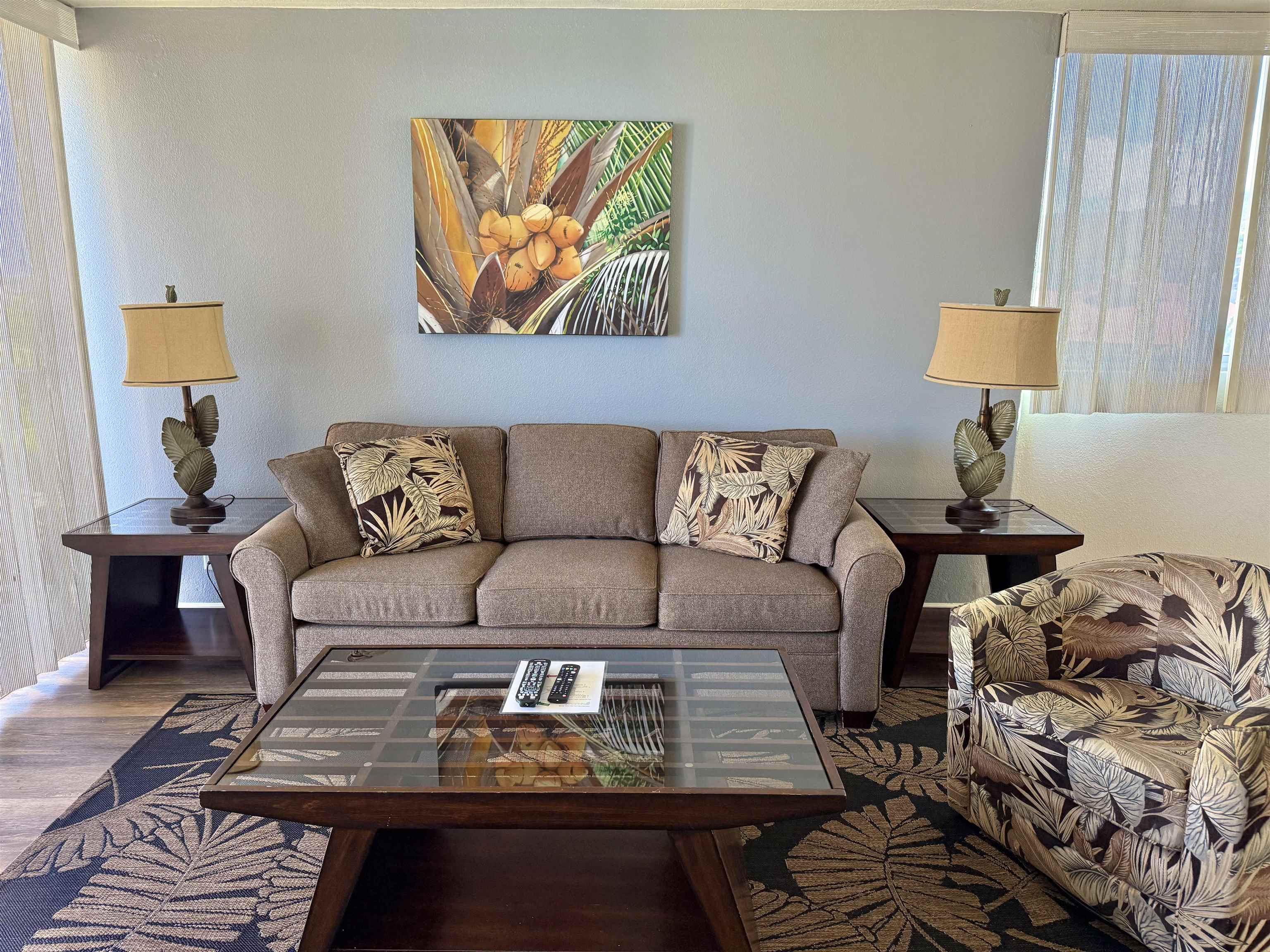 4365 Lower Honoapiilani Road, Unit 801 Lahaina, HI 96761 - Photo 3 of 24 a living room with furniture and wooden floor