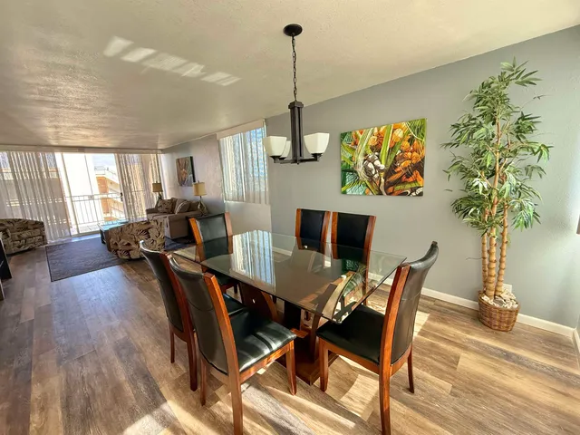 a view of a dining room with furniture window and wooden floor