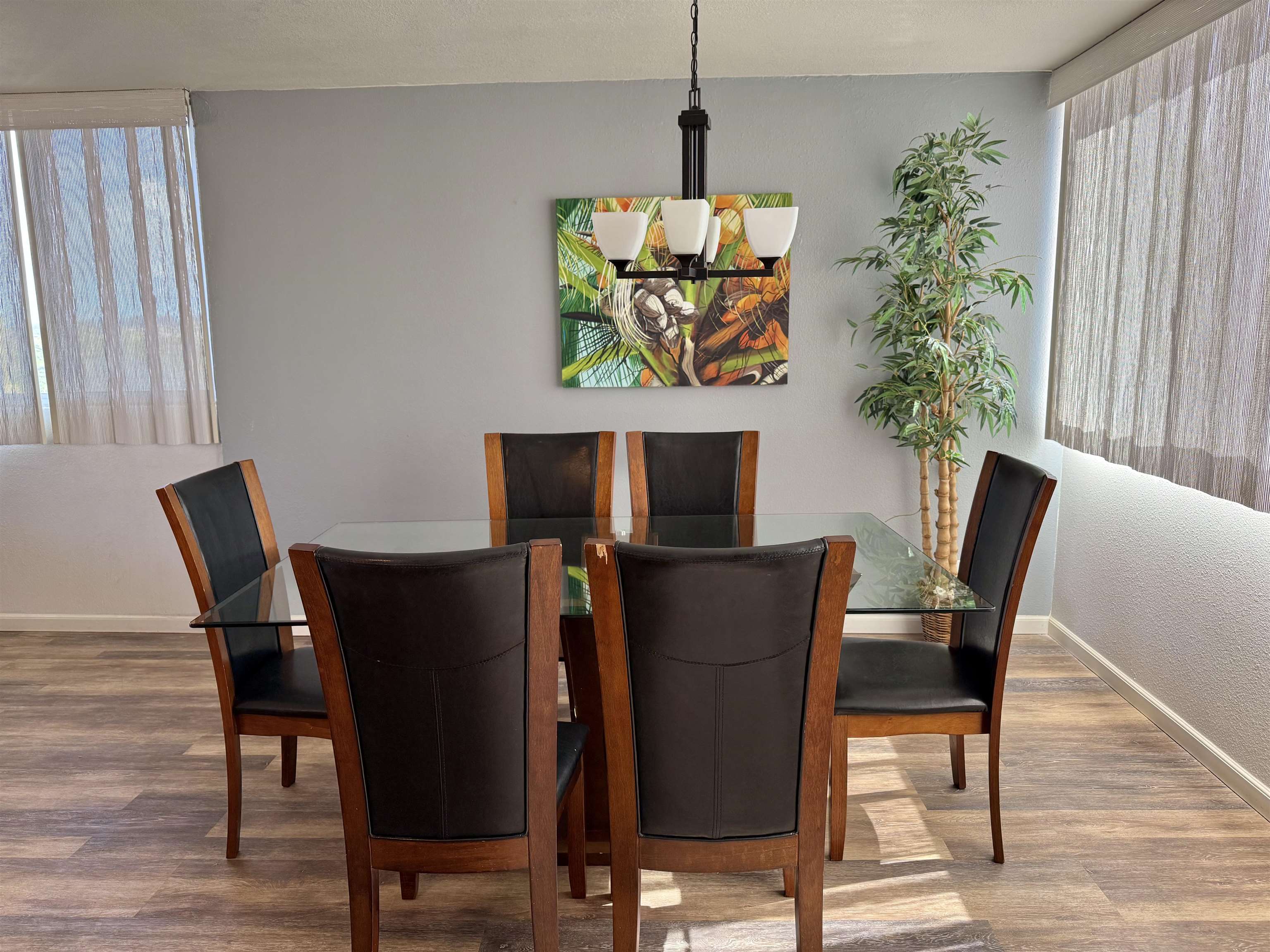 4365 Lower Honoapiilani Road, Unit 801 Lahaina, HI 96761 - Photo 7 of 24 a view of a dining room with furniture window and wooden floor