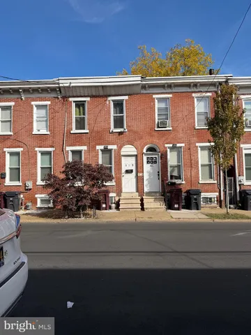 a front view of a house with a outdoor space