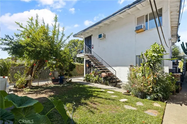 a backyard of a house with lots of green space