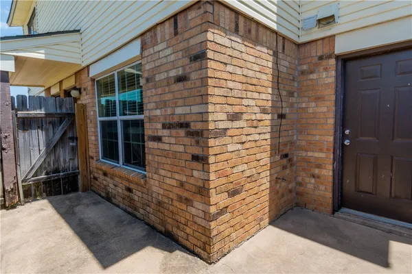 a view of front door of house and stairs