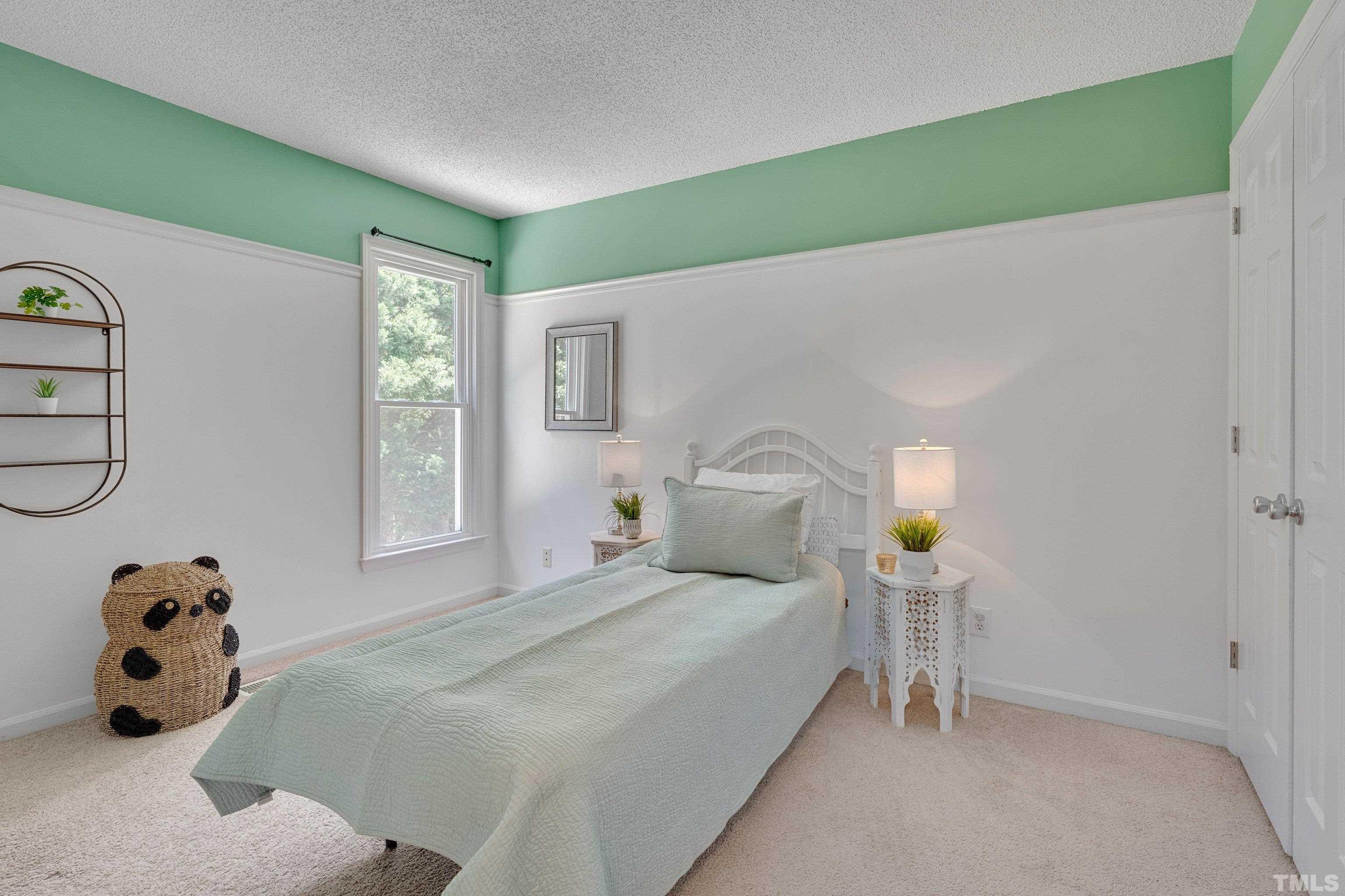 4101 Olde Coach Road Durham, NC 27707 - Photo 17 of 21 a bedroom with a bed and a window