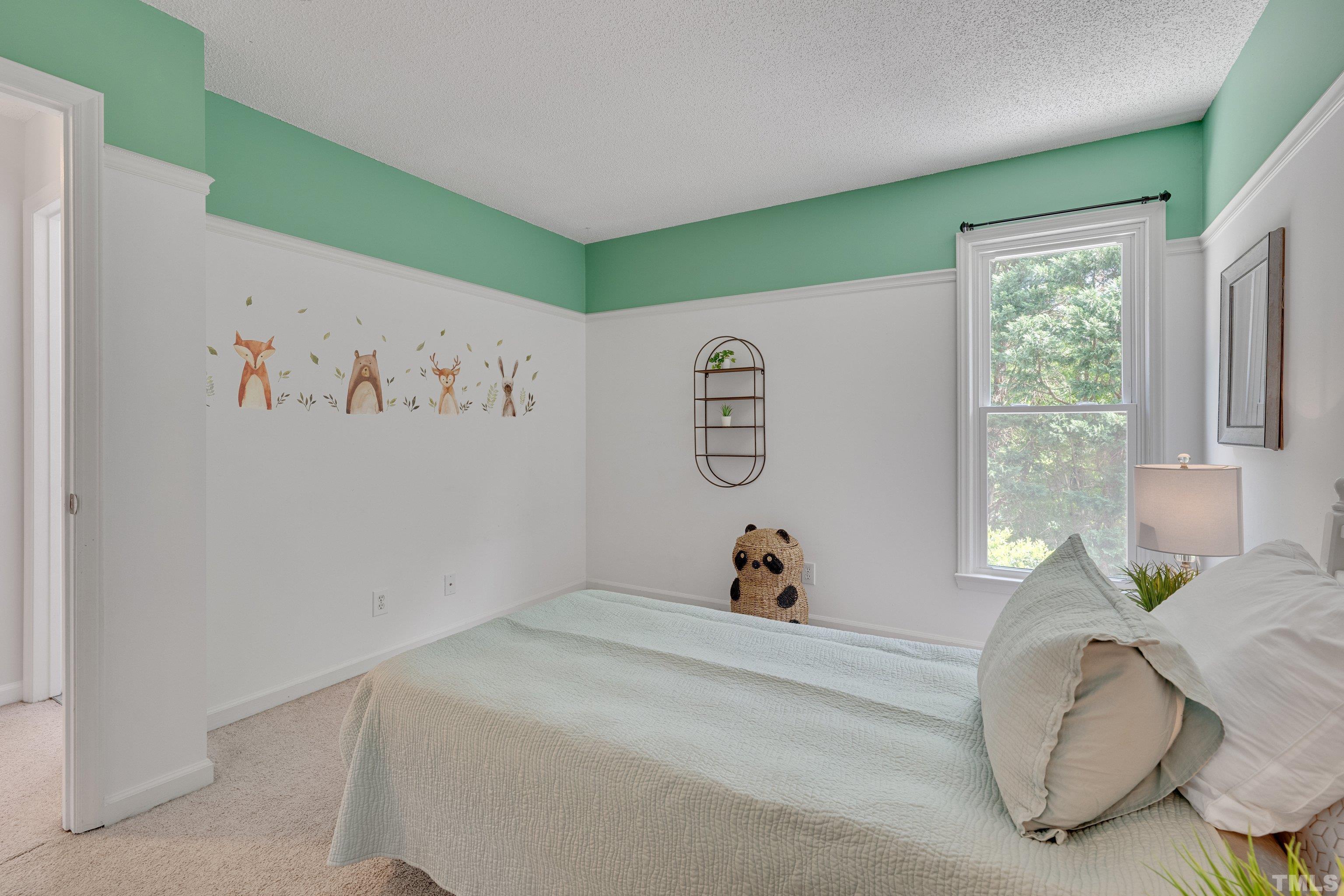 4101 Olde Coach Road Durham, NC 27707 - Photo 18 of 21 a bed room with a bed and a window