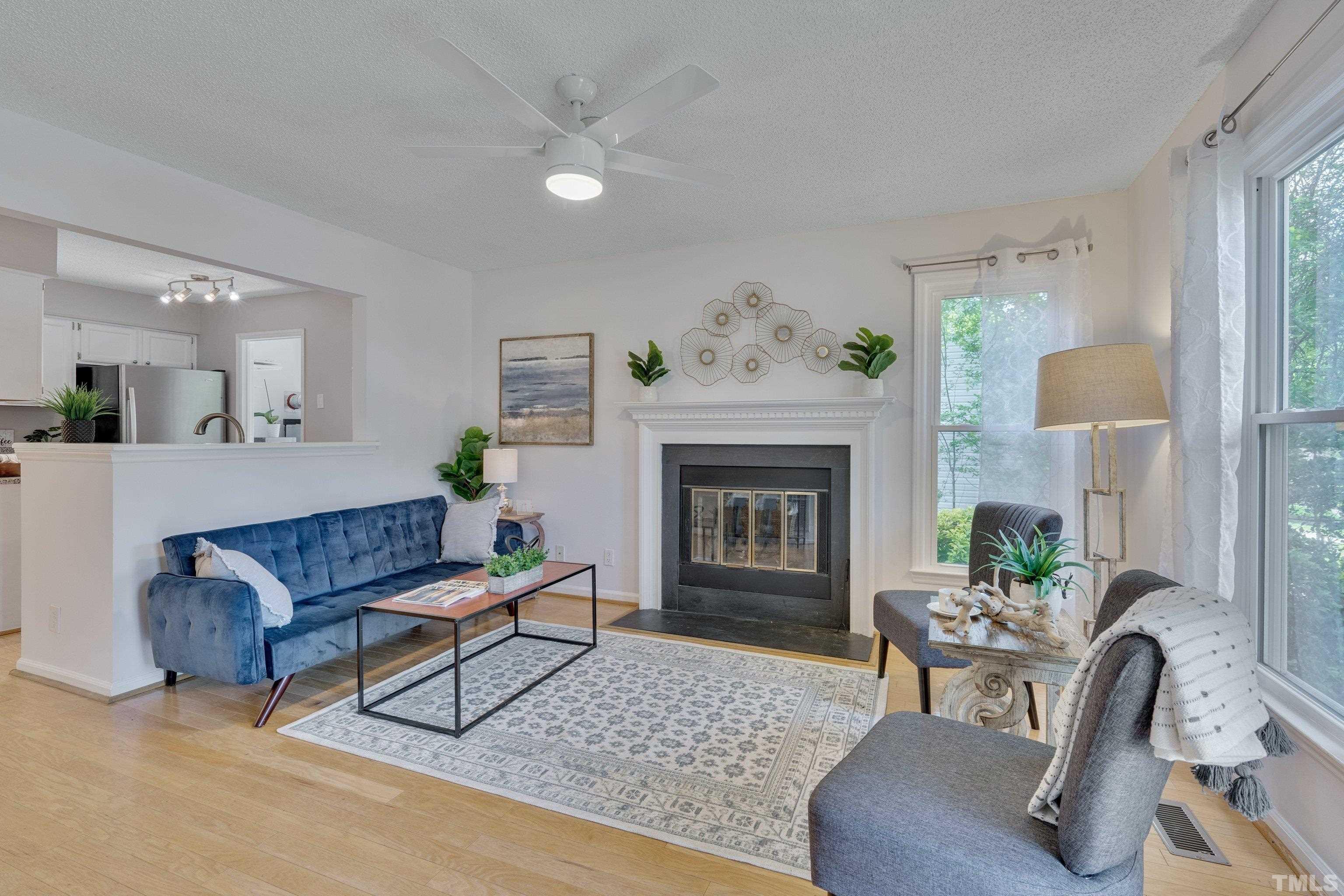 4101 Olde Coach Road Durham, NC 27707 - Photo 5 of 21 a living room with furniture and a fireplace