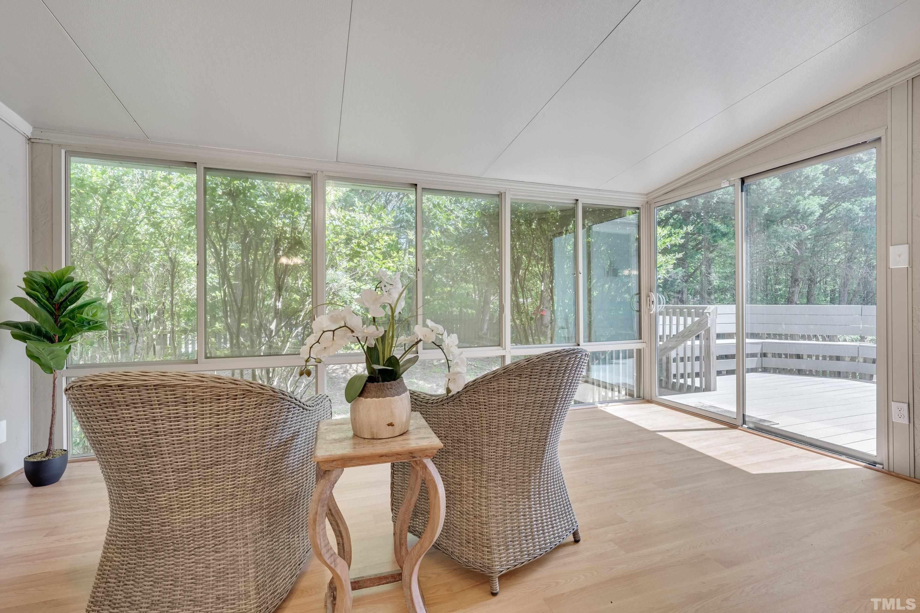 4101 Olde Coach Road Durham, NC 27707 - Photo 9 of 21 a dining room with furniture and large windows