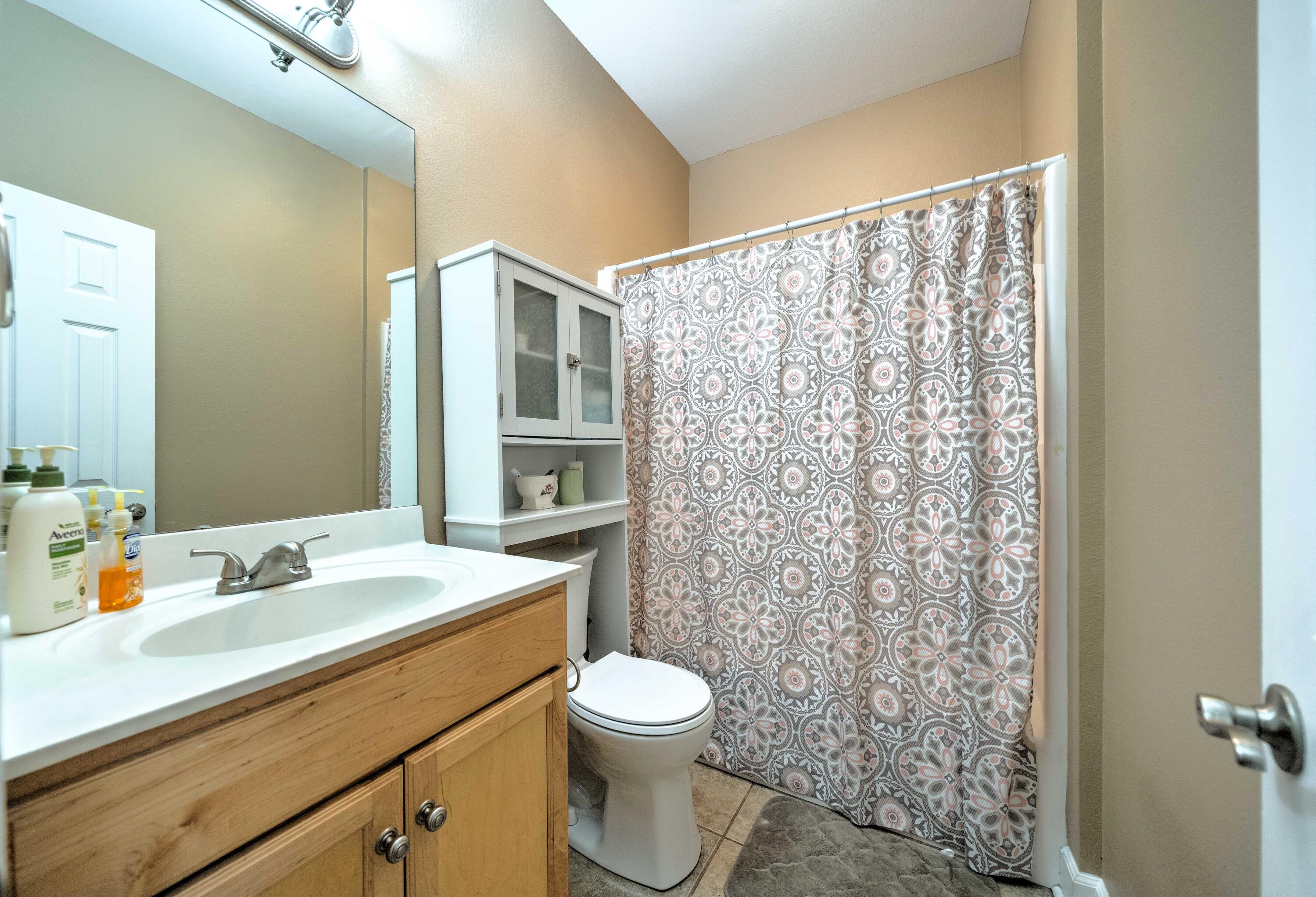 700 Timber Ridge Court Eastpoint, FL 32328 - Photo 14 of 20 a bathroom with a sink toilet and shower