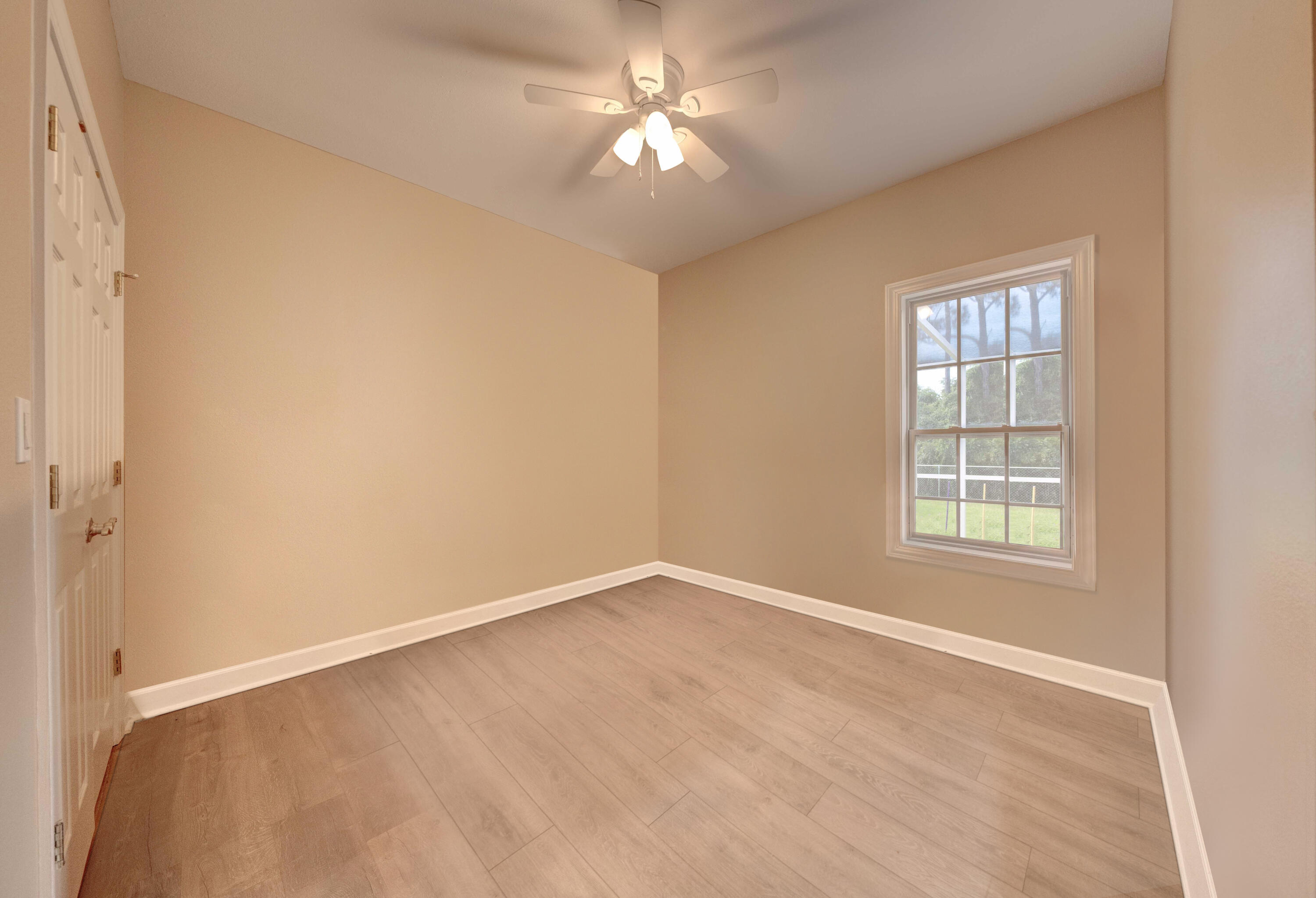 700 Timber Ridge Court Eastpoint, FL 32328 - Photo 17 of 20 a view of an empty room with a window
