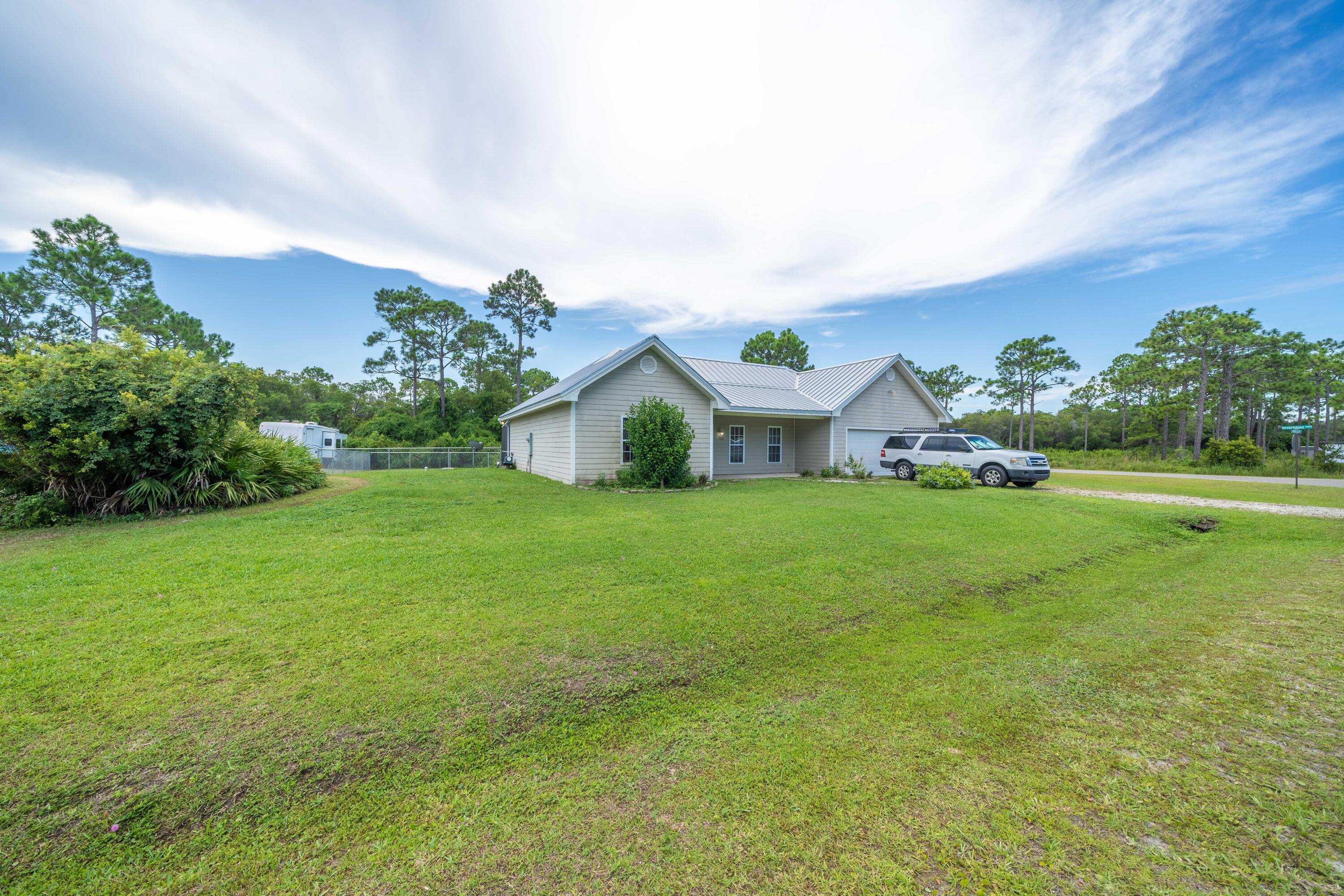700 Timber Ridge Court Eastpoint, FL 32328 - Photo 18 of 20 a front view of house with garden
