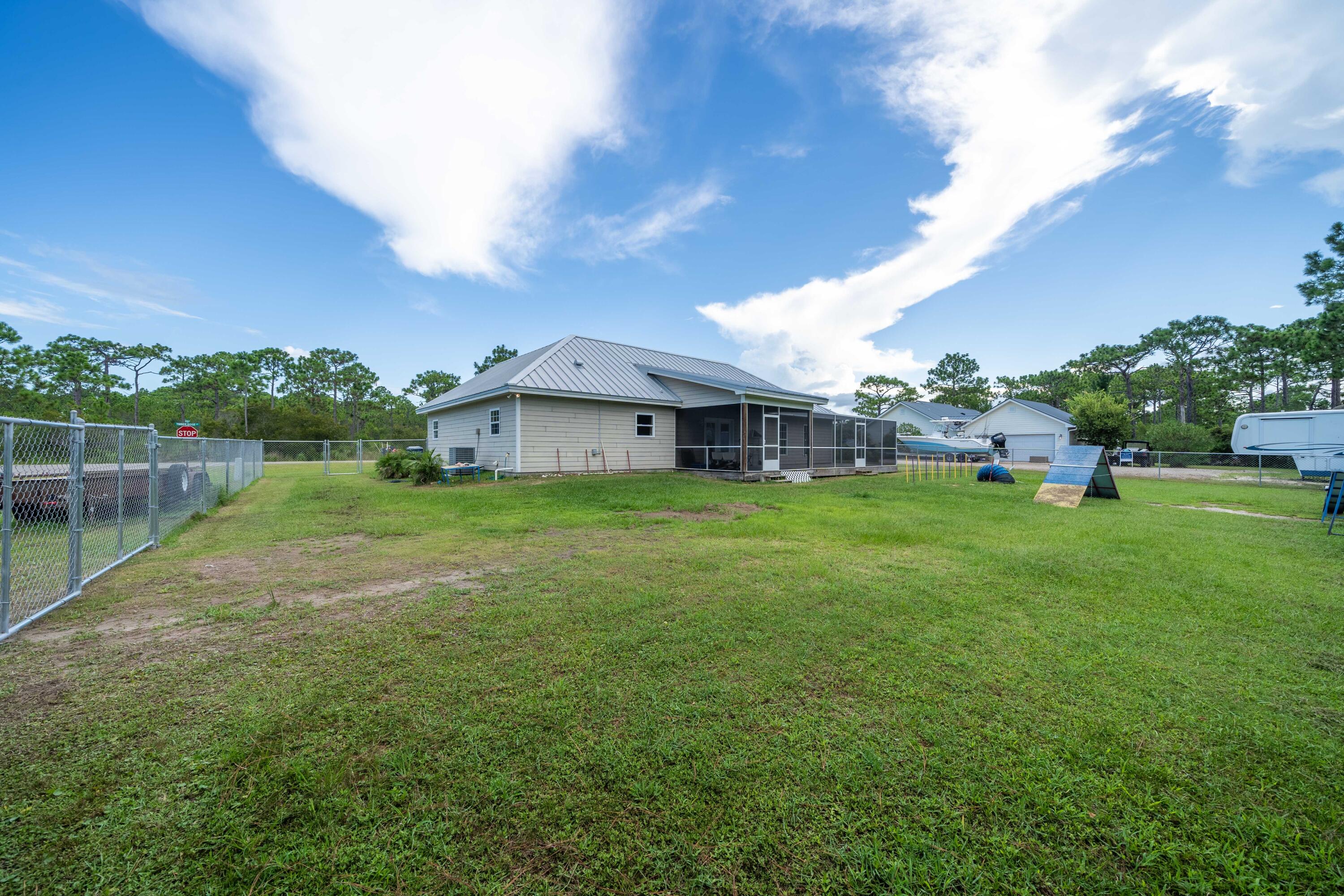 700 Timber Ridge Court Eastpoint, FL 32328 - Photo 20 of 20 a front view of a house with garden