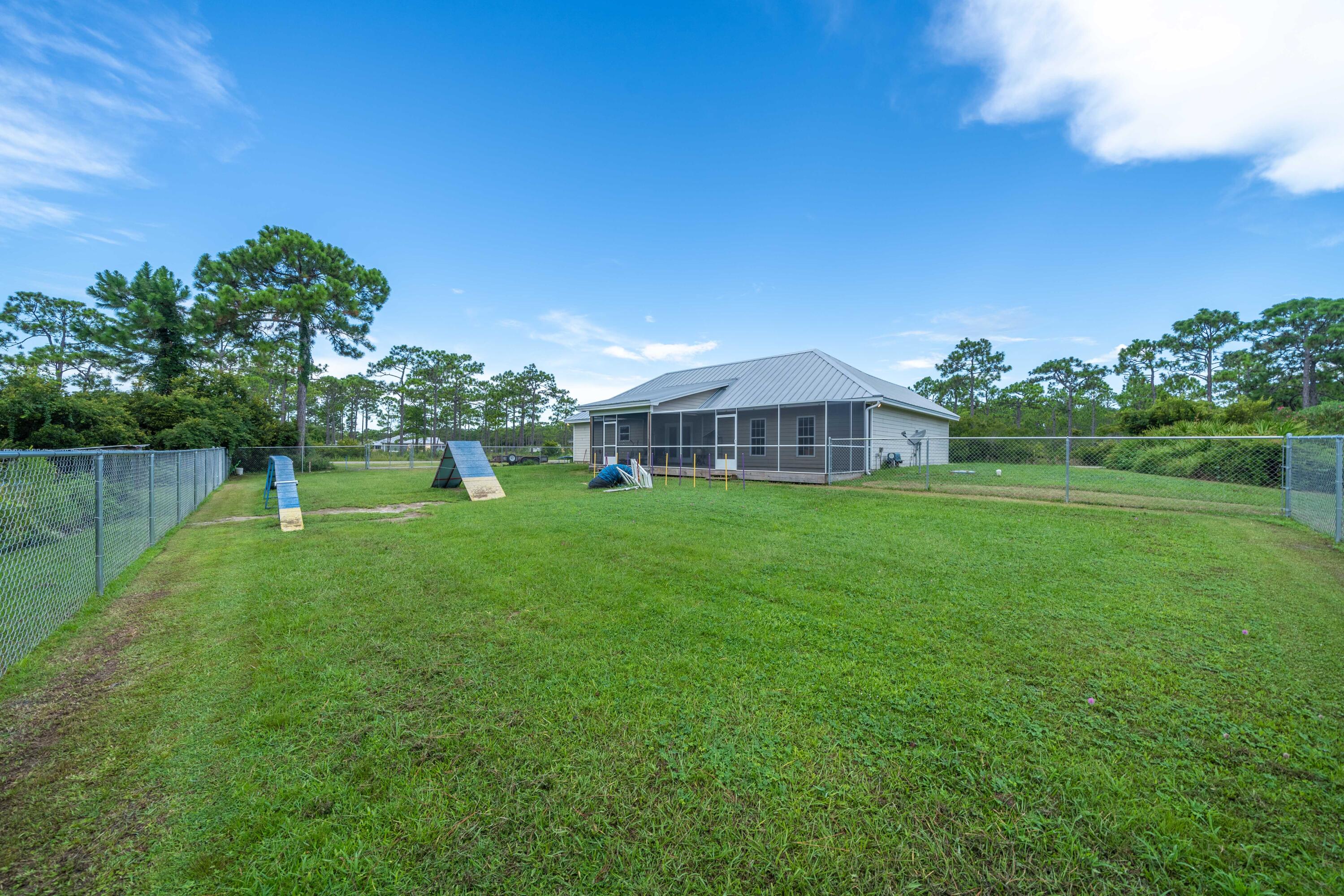 700 Timber Ridge Court Eastpoint, FL 32328 - Photo 3 of 20 a front view of a house with garden
