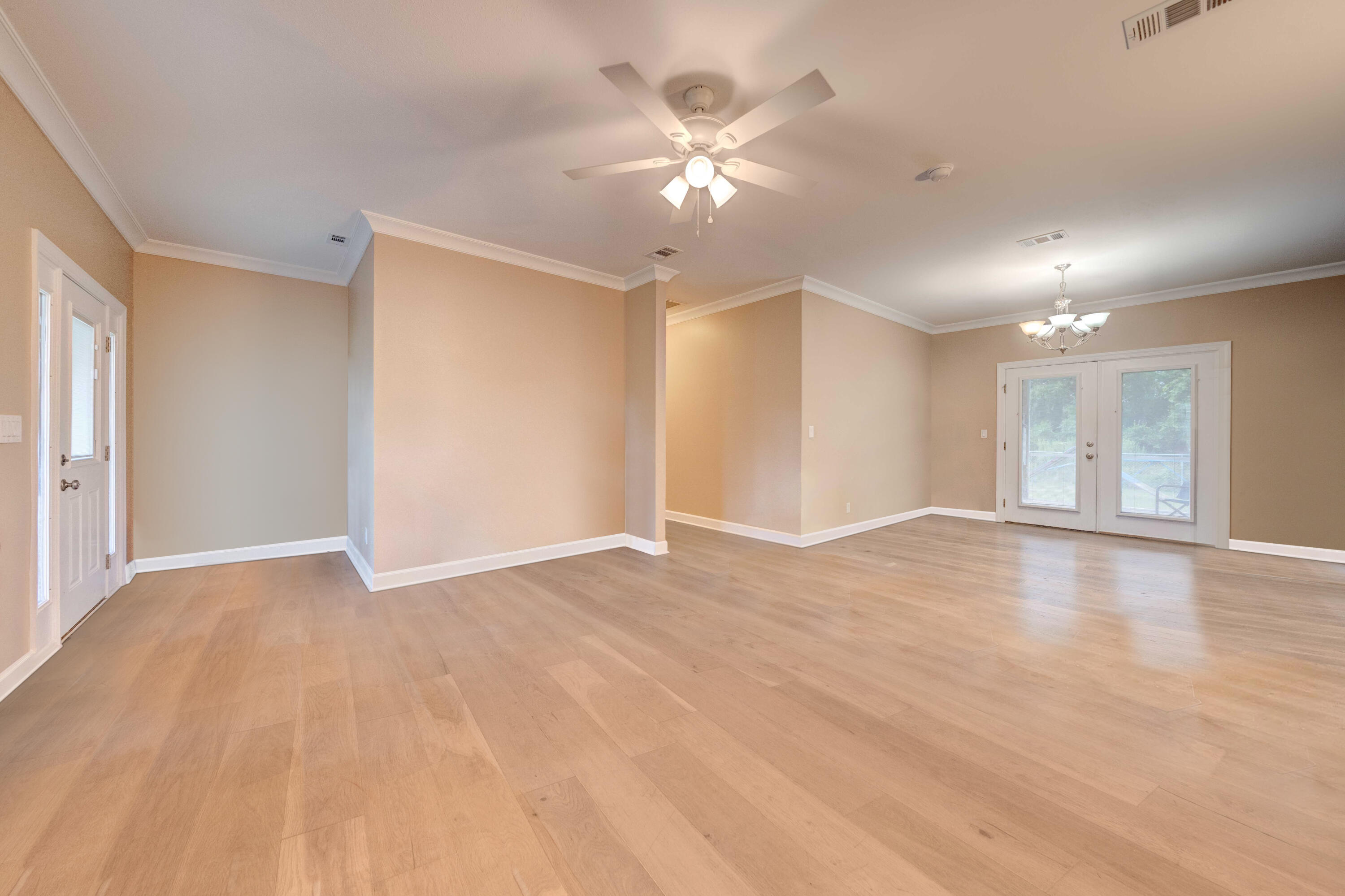 700 Timber Ridge Court Eastpoint, FL 32328 - Photo 4 of 20 a view of an empty room with a chandelier fan