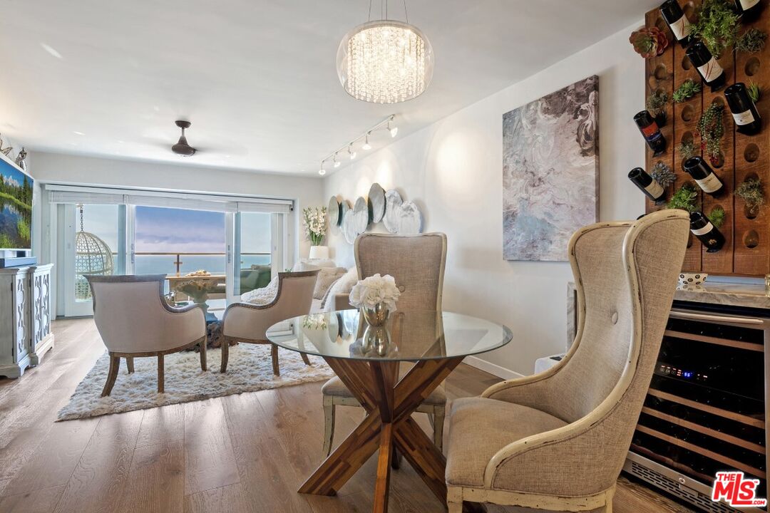 18147 Coastline Drive, Unit 3 Malibu, CA 90265 - Photo 13 of 40 a view of a livingroom with furniture and wooden floor