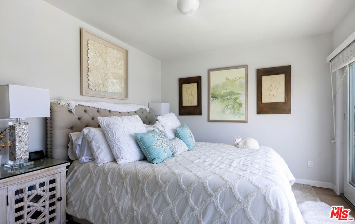 18147 Coastline Drive, Unit 3 Malibu, CA 90265 - Photo 16 of 40 a bedroom with a bed and a window