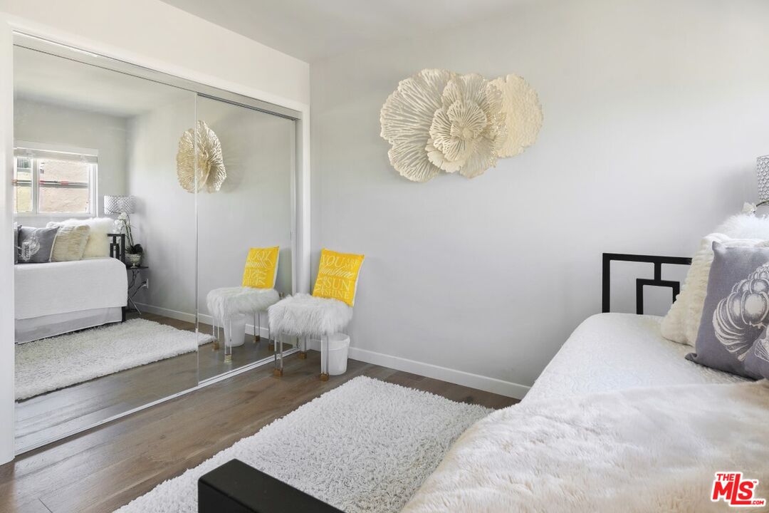 18147 Coastline Drive, Unit 3 Malibu, CA 90265 - Photo 28 of 40 a bedroom with a bed and couch