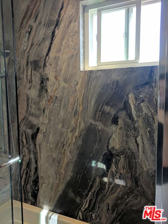 18147 Coastline Drive, Unit 3 Malibu, CA 90265 - Photo 30 of 40 a bathroom with a shower