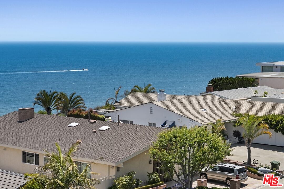 18147 Coastline Drive, Unit 3 Malibu, CA 90265 - Photo 3 of 40 an aerial view of a house with yard and seating space