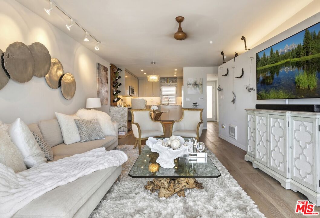 18147 Coastline Drive, Unit 3 Malibu, CA 90265 - Photo 8 of 40 a living room with furniture and a flat screen tv