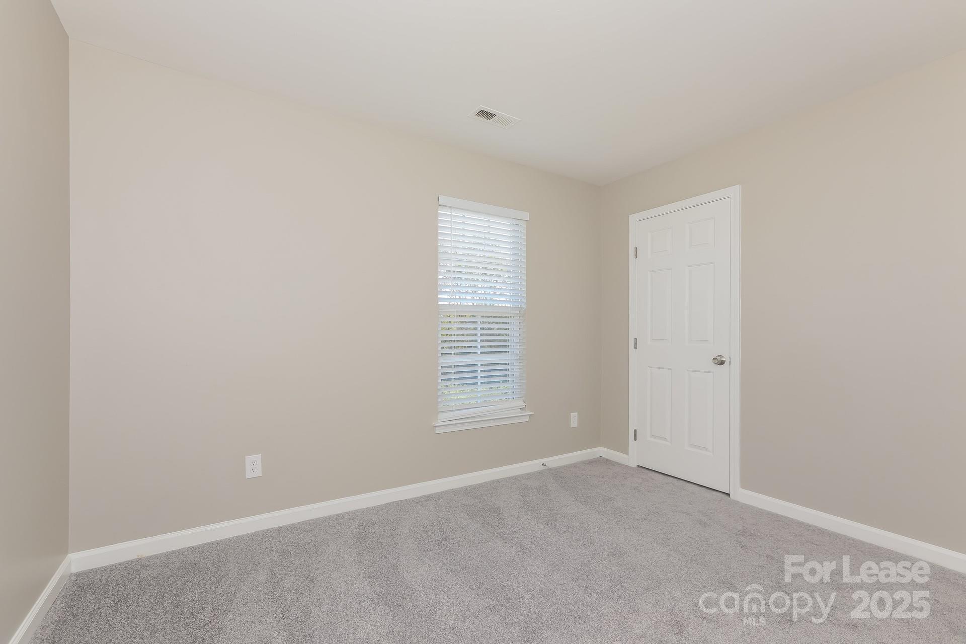 7037 Honey Tree Lane Indian Trail, NC 28079 - Photo 10 of 17 a view of an empty room with a window
