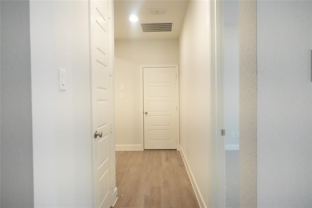 4115 Hudson Street Fate, TX 75087 - Photo 11 of 24 a view of a bathroom from a hallway