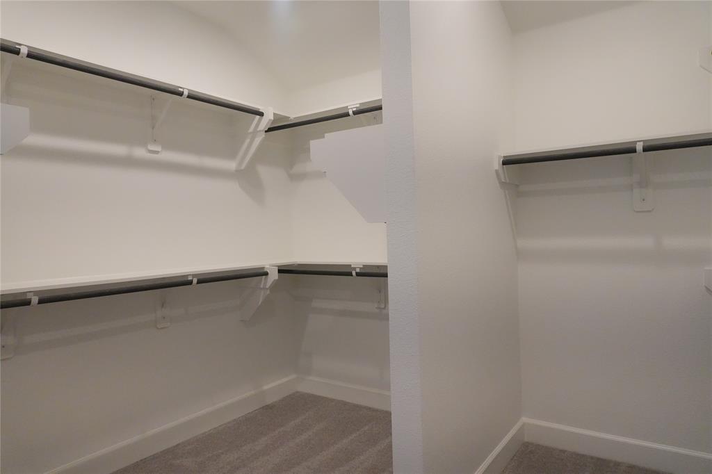 4115 Hudson Street Fate, TX 75087 - Photo 17 of 24 a view of an empty walk in closet