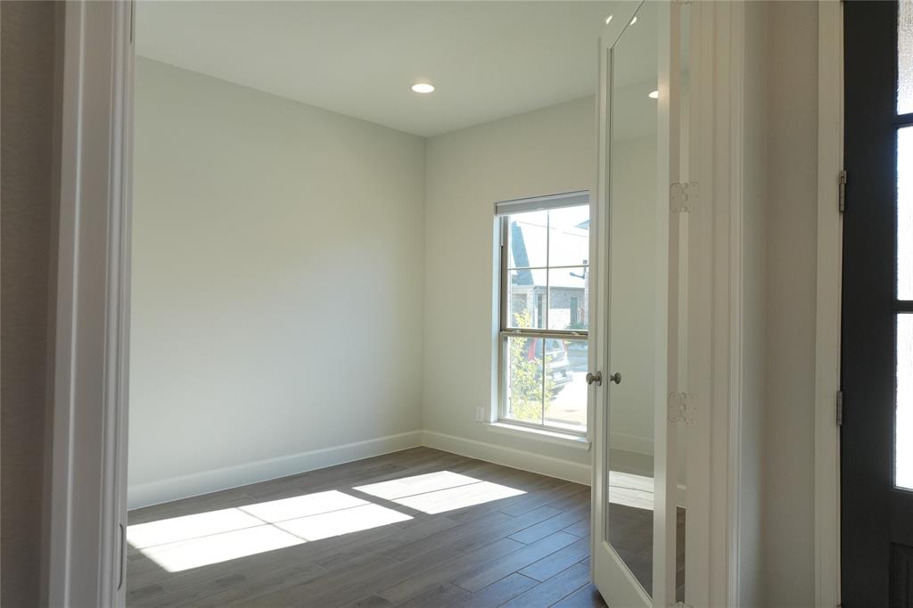 4115 Hudson Street Fate, TX 75087 - Photo 4 of 24 a view of empty room with wooden floor