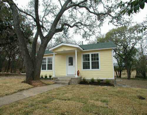 front view of a house with a yard