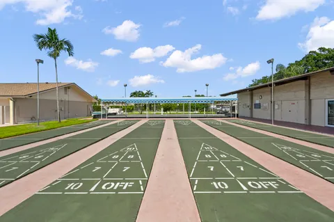 a view of swimming pool with a yard