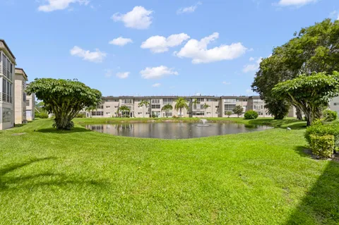 a view of swimming pool with outdoor seating and yard