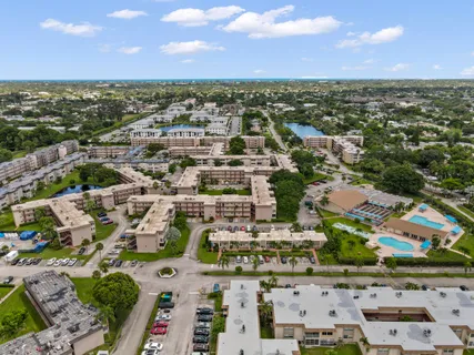 an aerial view of residential houses with city view