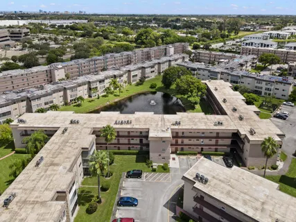 a view of city from balcony with outdoor seating