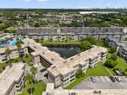 an aerial view of a house with a lake view