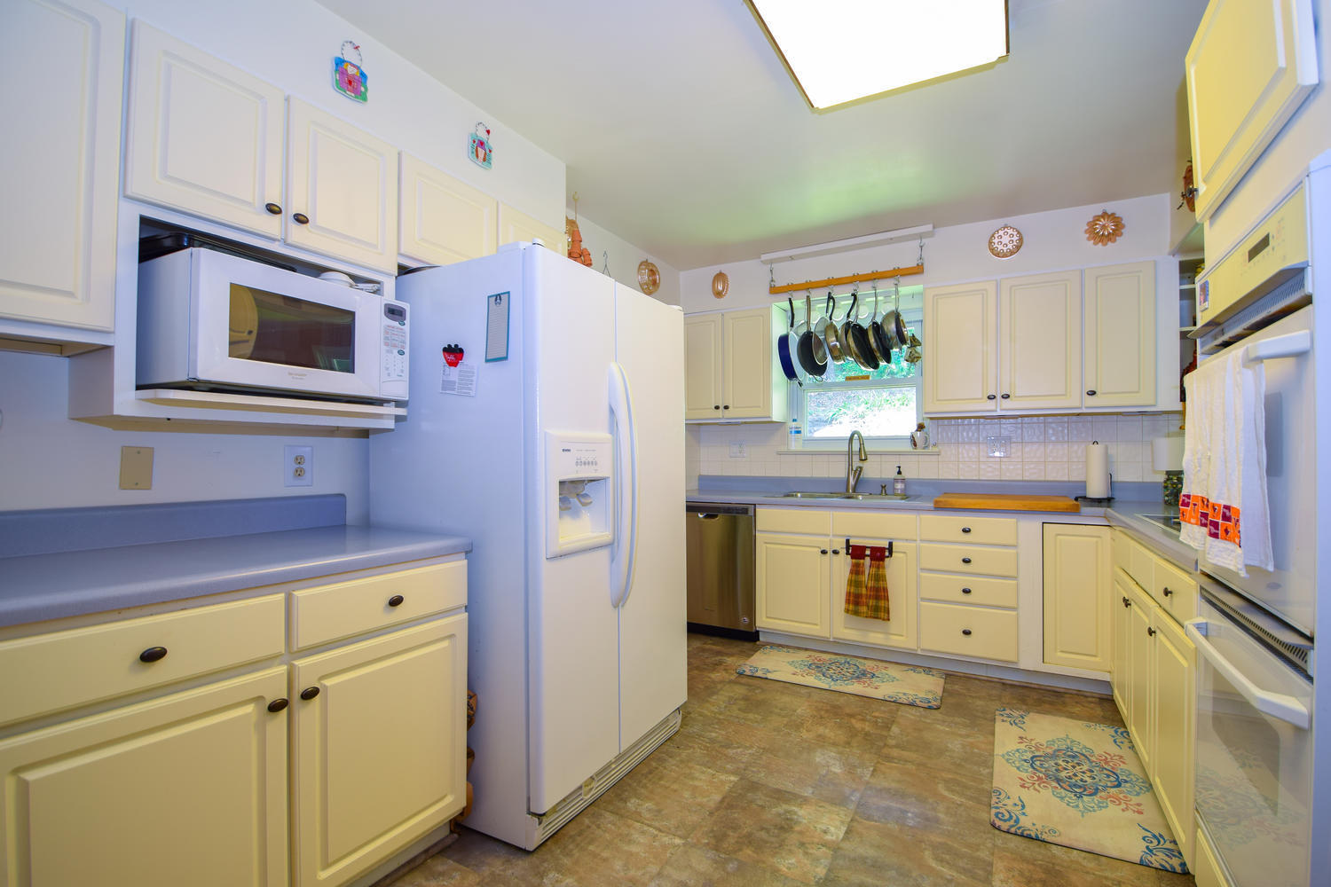 1638 Weaver Road Salem, VA 24153 - Photo 11 of 28 a kitchen with cabinets stainless steel appliances and a window