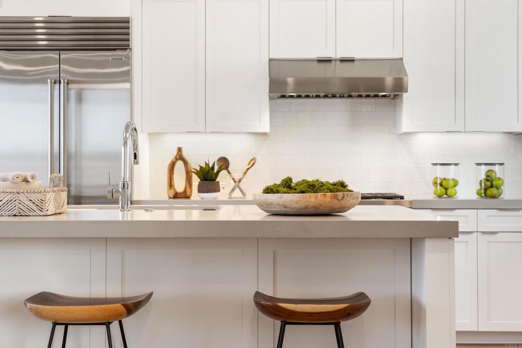 320 Chinquapin Avenue Carlsbad, CA 92008 - Photo 27 of 49 a kitchen with a sink and cabinets