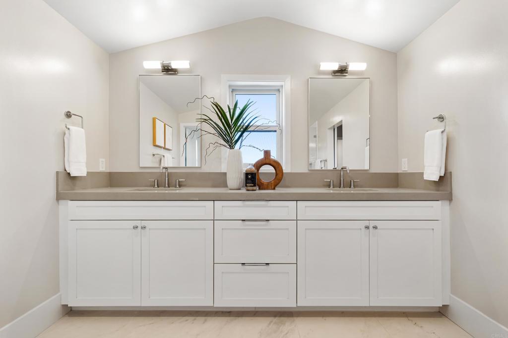 320 Chinquapin Avenue Carlsbad, CA 92008 - Photo 35 of 49 a bathroom with a sink and a mirror