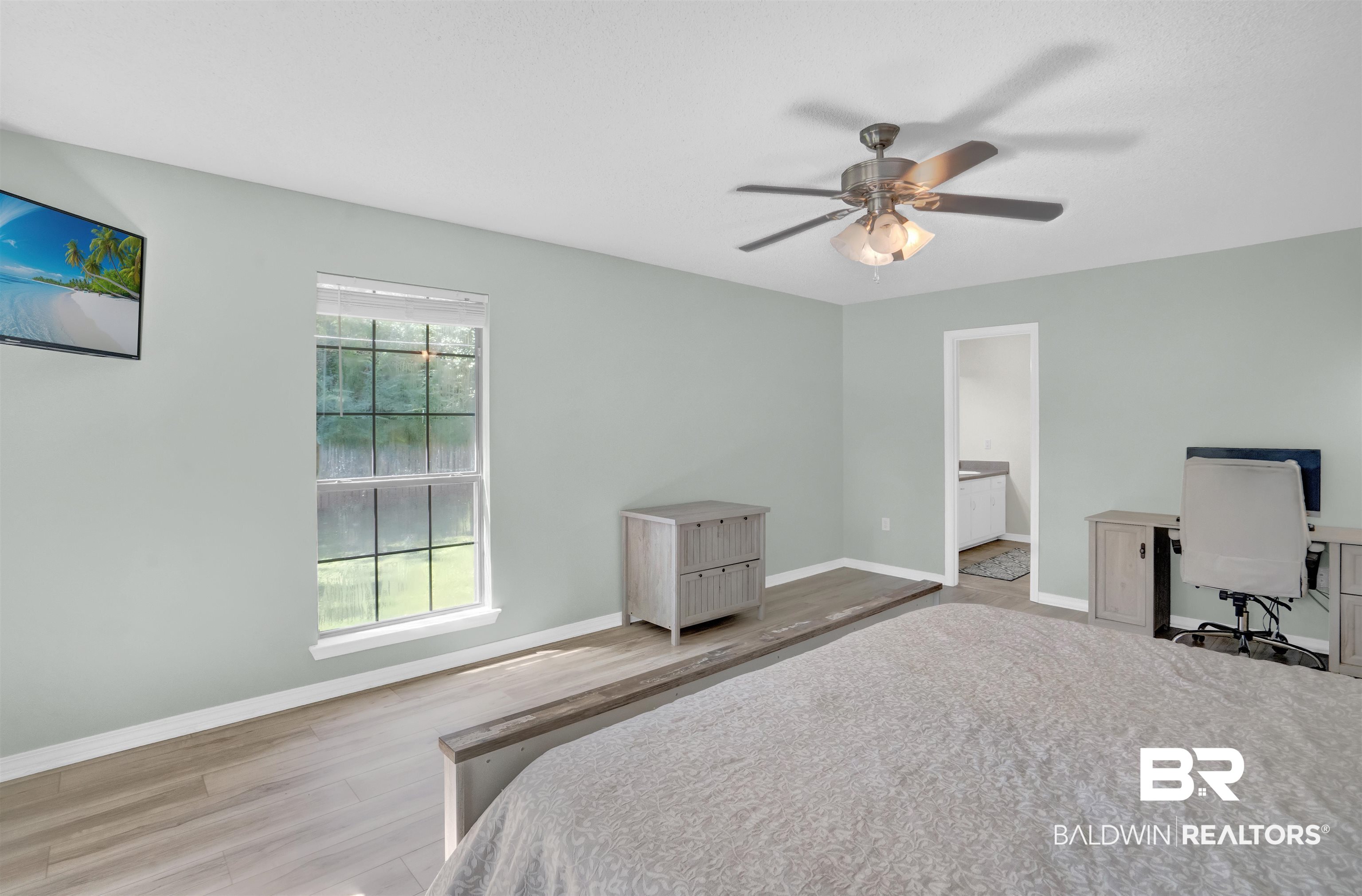30871 Stanton Road Spanish Fort, AL 36527 - Photo 25 of 35 Bedroom featuring ceiling fan, connected bathroom, and light hardwood / wood-style floors