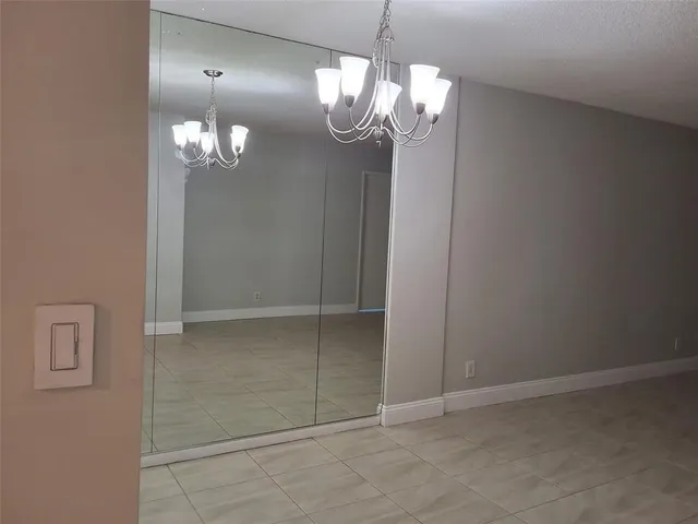 en view of a chandelier in big room and chandelier