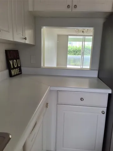 a view of washer and dryer with wooden floor