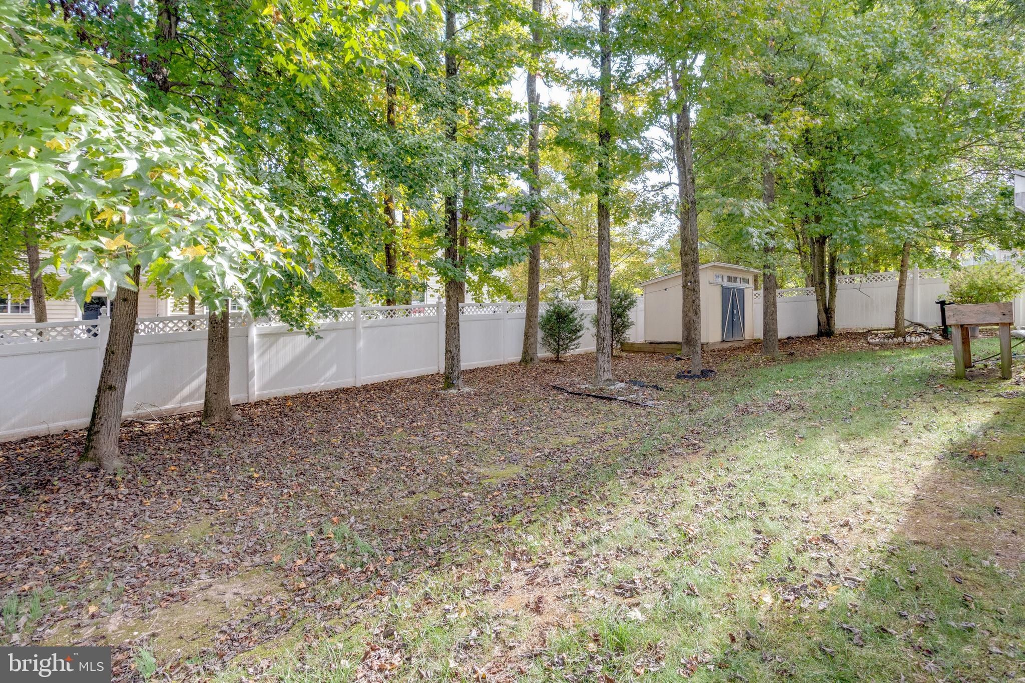 9013 Helmsley Drive Clinton, MD 20735 - Photo 11 of 68 a backyard of a house with lots of green space