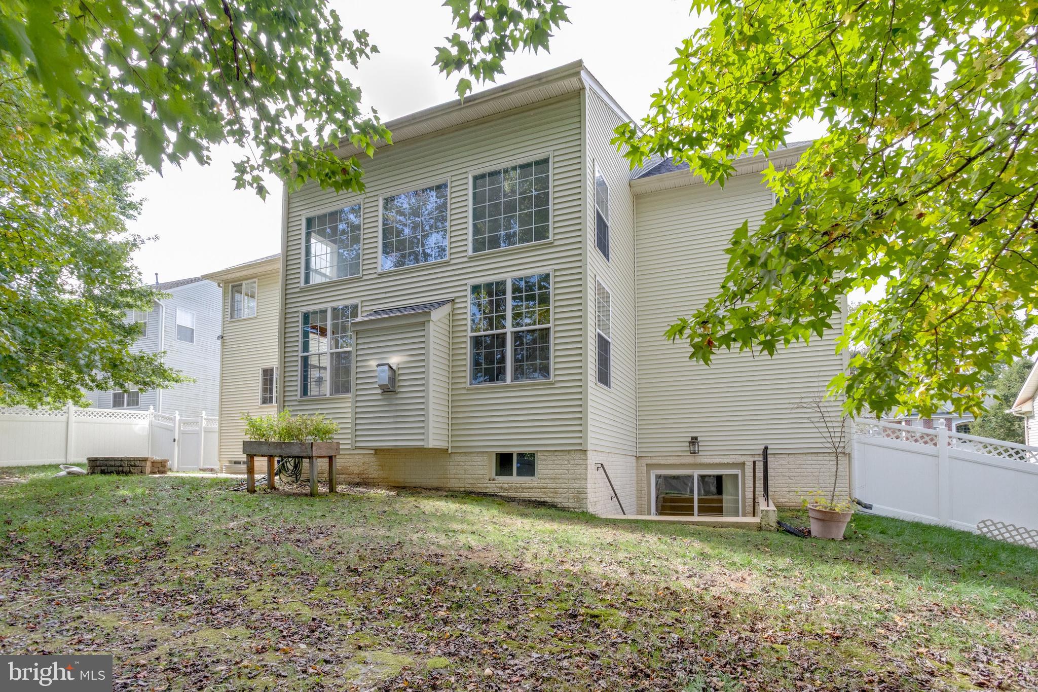 9013 Helmsley Drive Clinton, MD 20735 - Photo 12 of 68 a house that has a tree in front of the house