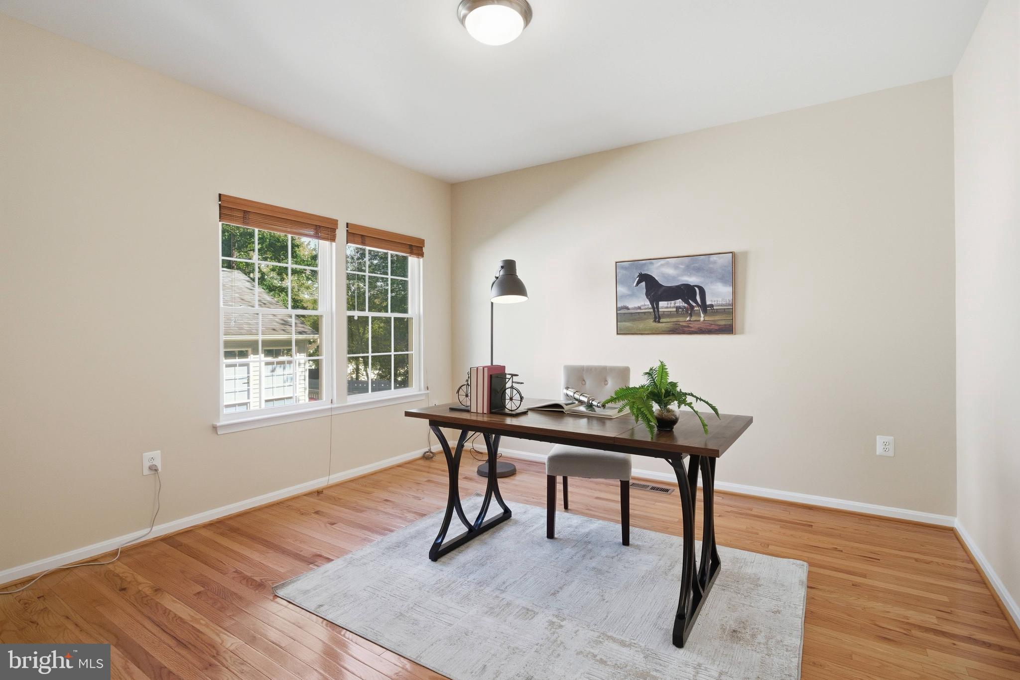 9013 Helmsley Drive Clinton, MD 20735 - Photo 13 of 68 a room with furniture table and a window